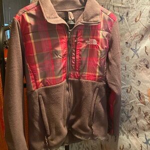 The north face zip up jacket. Gray with pink, gray, yellow striped plaid. Large